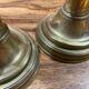 Pair of 19th-century brass pusher candlesticks