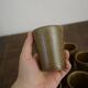 Lot of ten cups of Digoin sandstone
