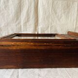 Old carved wooden medicine cabinet with beveled mirror