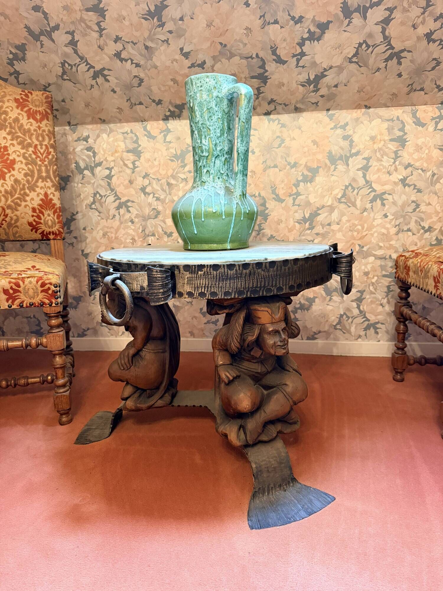 Wrought iron and hammered marble coffee table circa 1950.