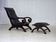 1970s, vintage armchair with footstool, black furniture leather.