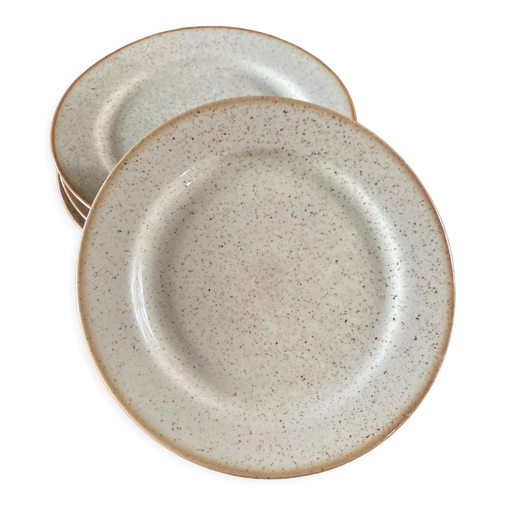 Four beige speckled plates