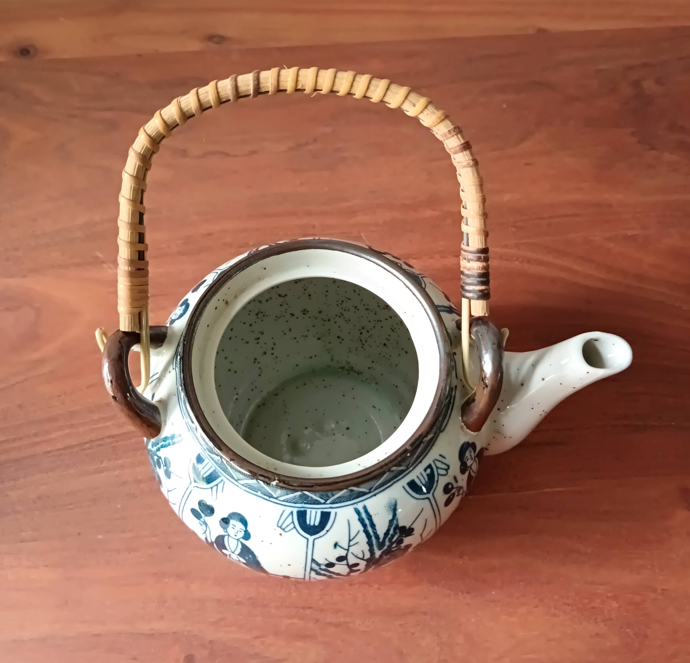 Asian ceramic and rattan tea set with plant geisha motifs