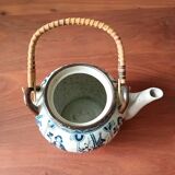 Asian ceramic and rattan tea set with plant geisha motifs