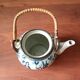 Asian ceramic and rattan tea set with plant geisha motifs