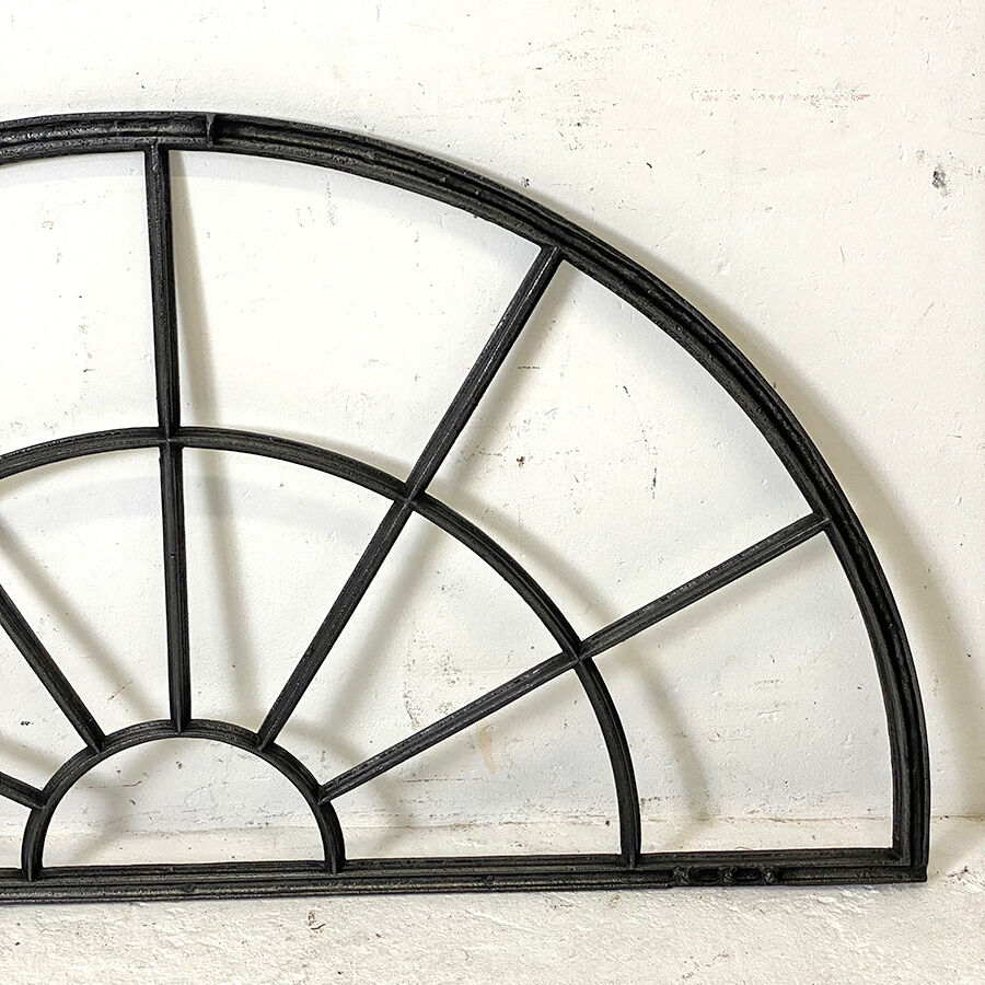 Old arched anthracite grey window