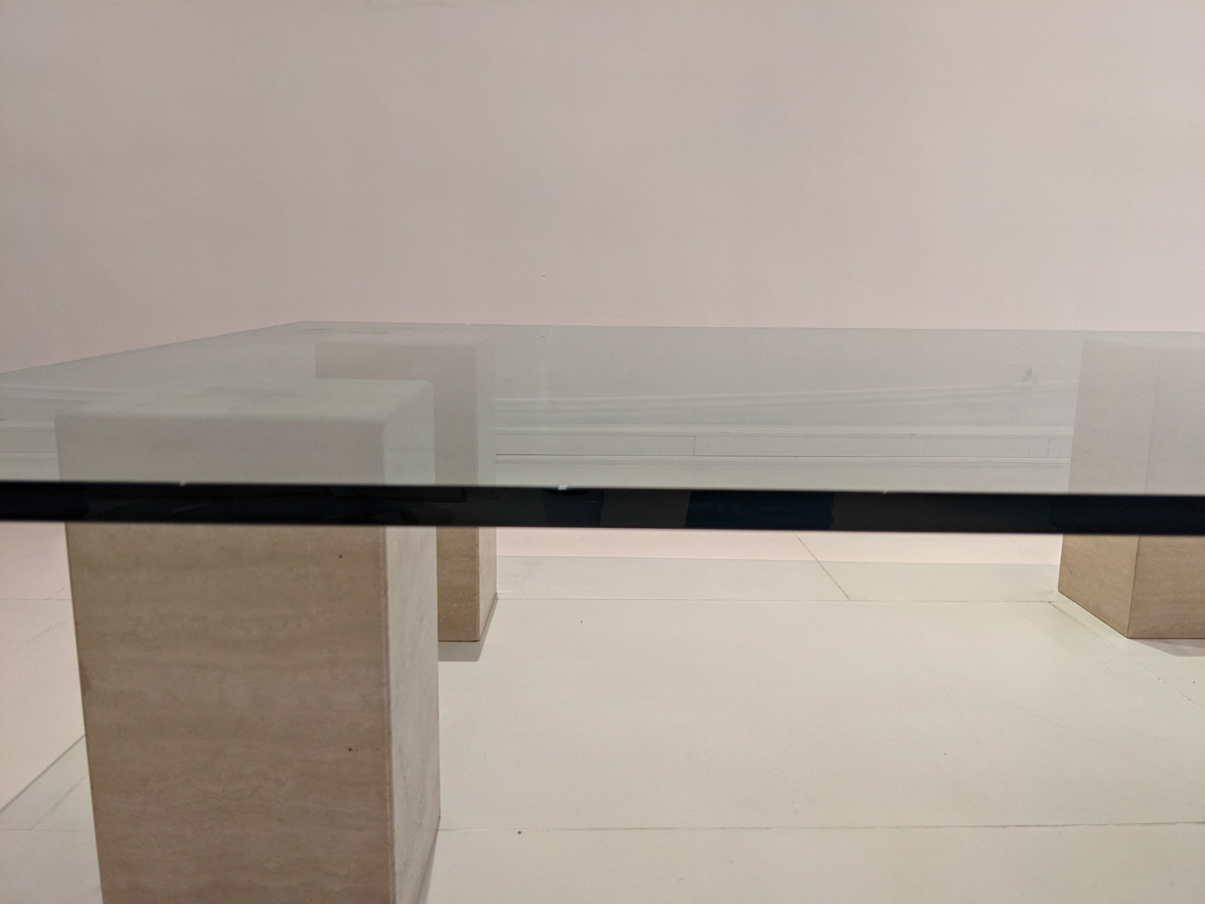 Glass table and travertine feet