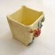 Small rose-patterned cache-pot in earthenware.