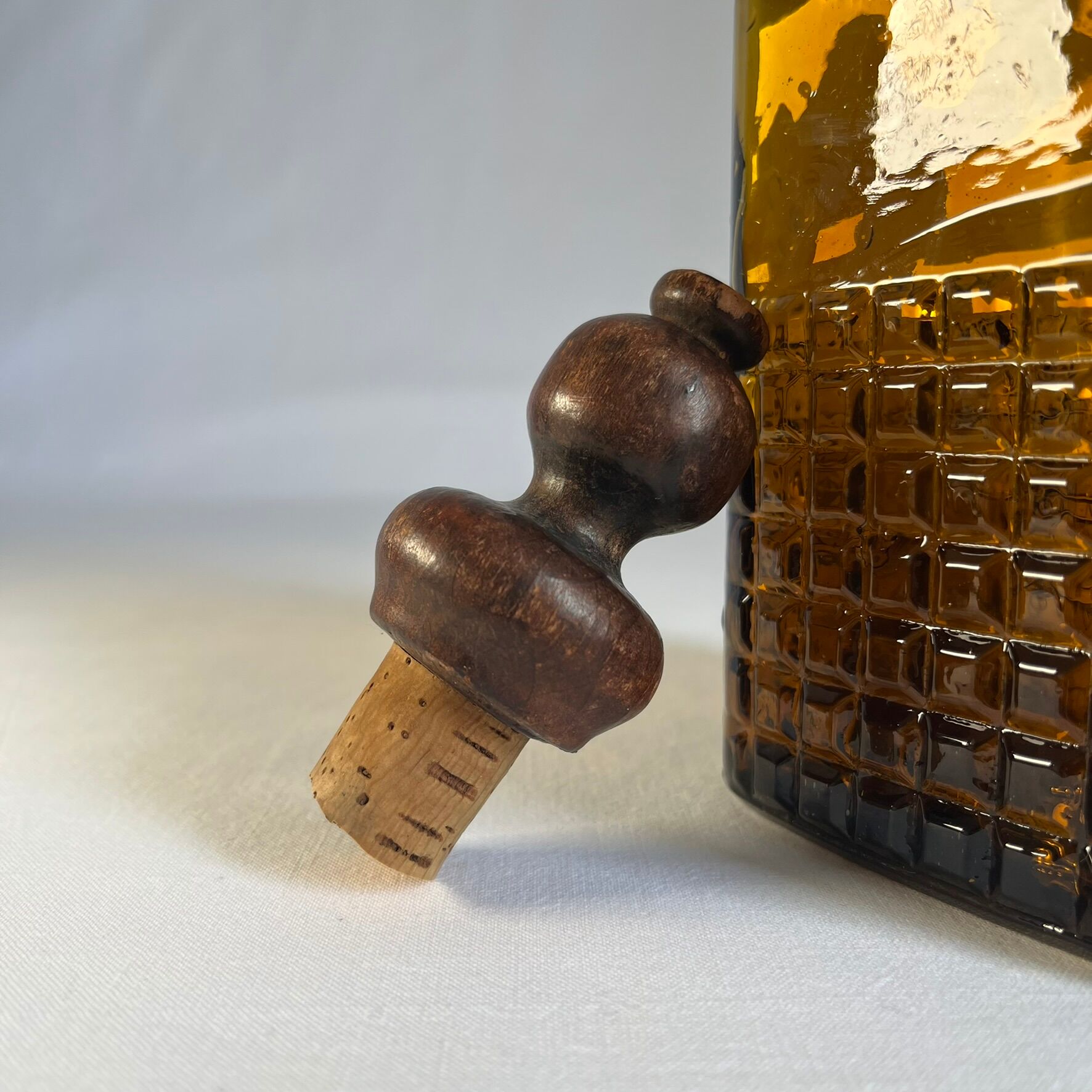 Amber glass and wood bottle