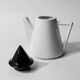Vintage ceramic coffee pot or teapot from the 1980s, postmodern Memphis design, black and white triangles.