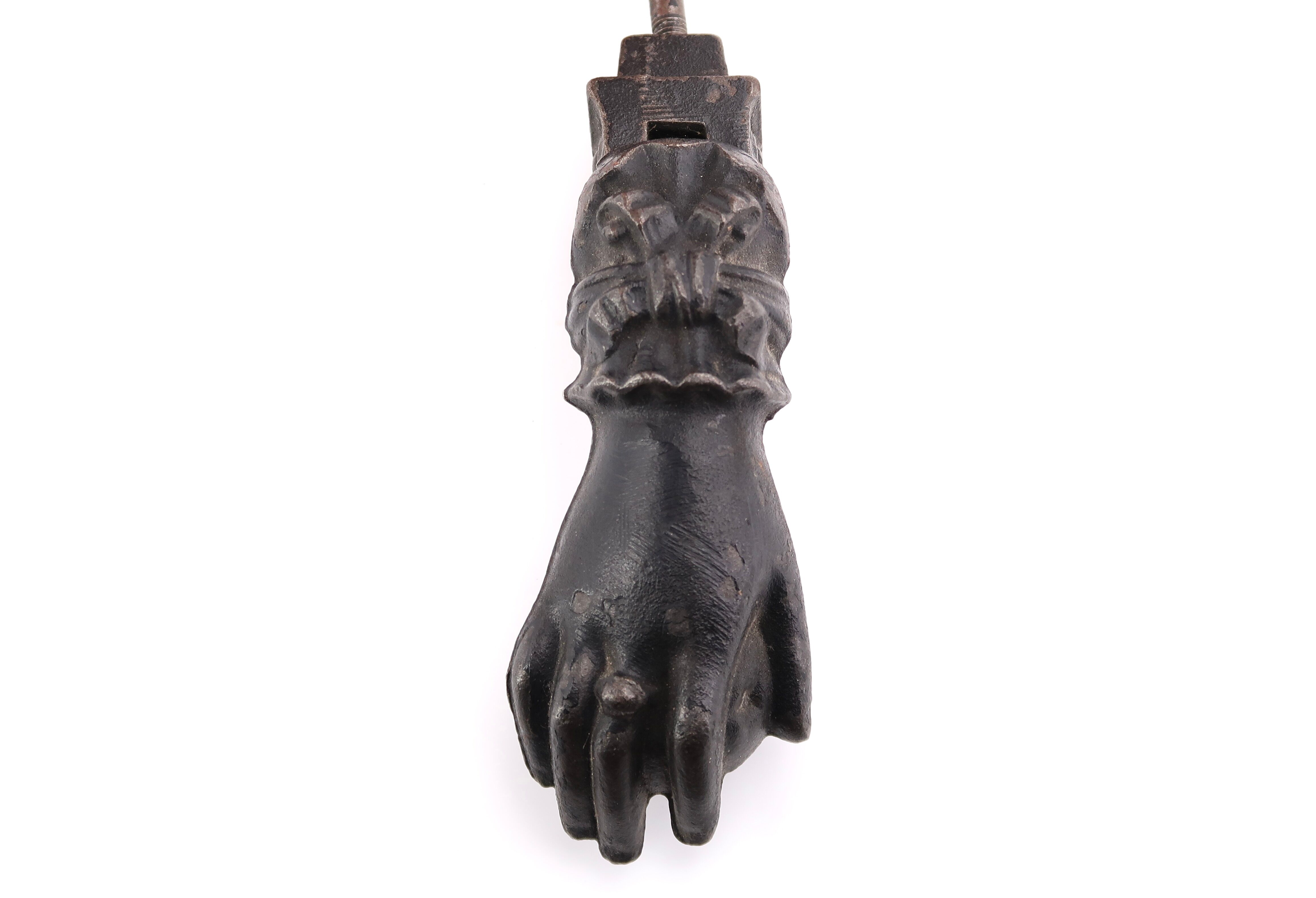 Hand-shaped metal door knocker, 1930s