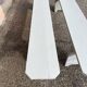 Pair of wooden benches painted white, French artisanal work.