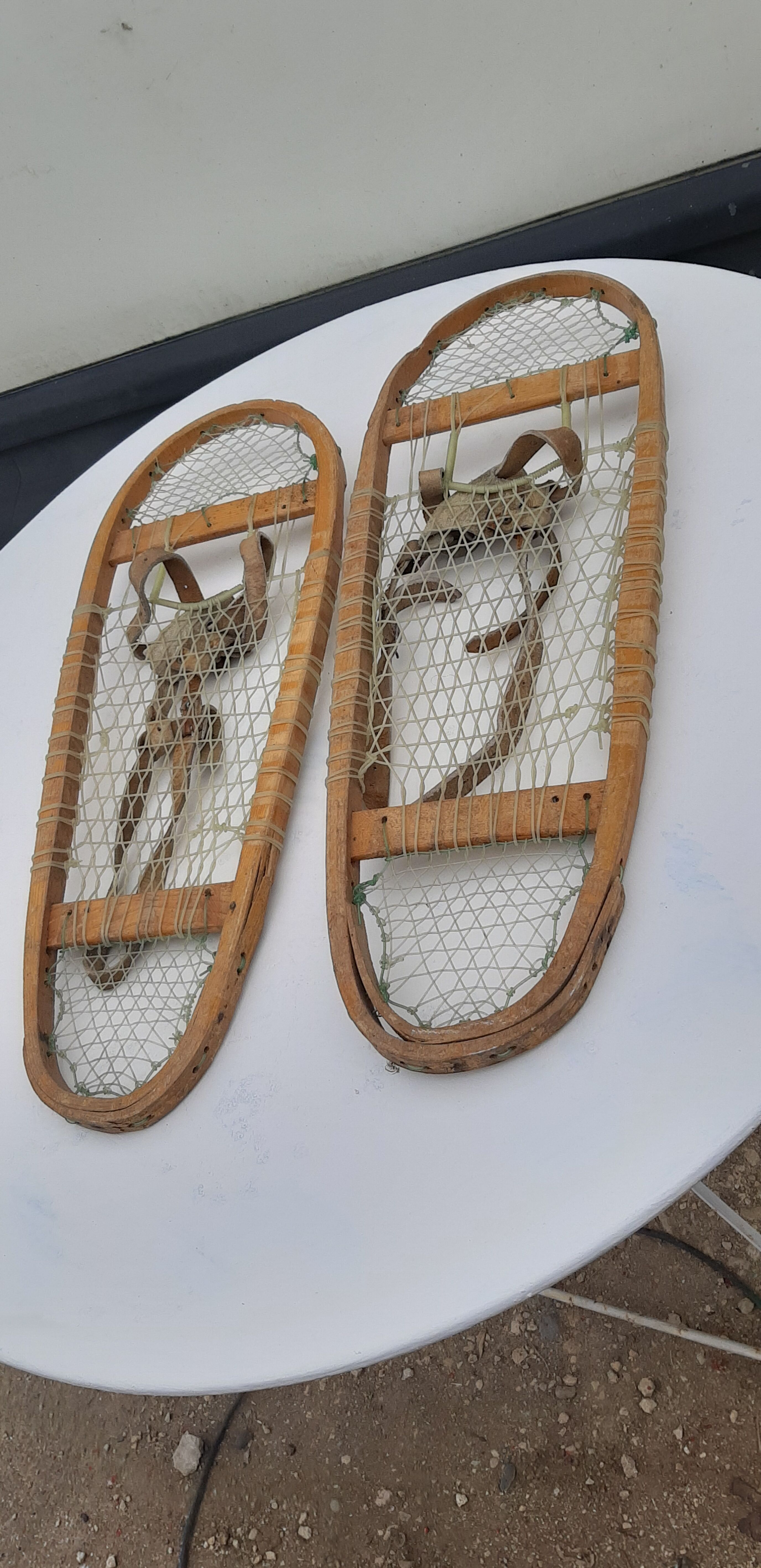 Old snowshoes made of wood and hoses