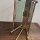 Brass magazine rack and blue-tinted glasses, 1950s.
