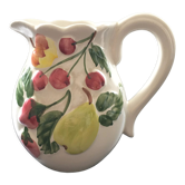Fruit-decorated pitcher in slipware