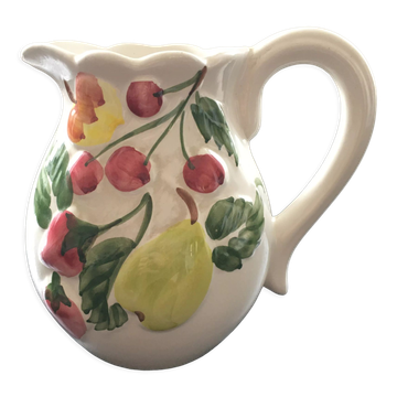 Fruit-decorated pitcher in slipware
