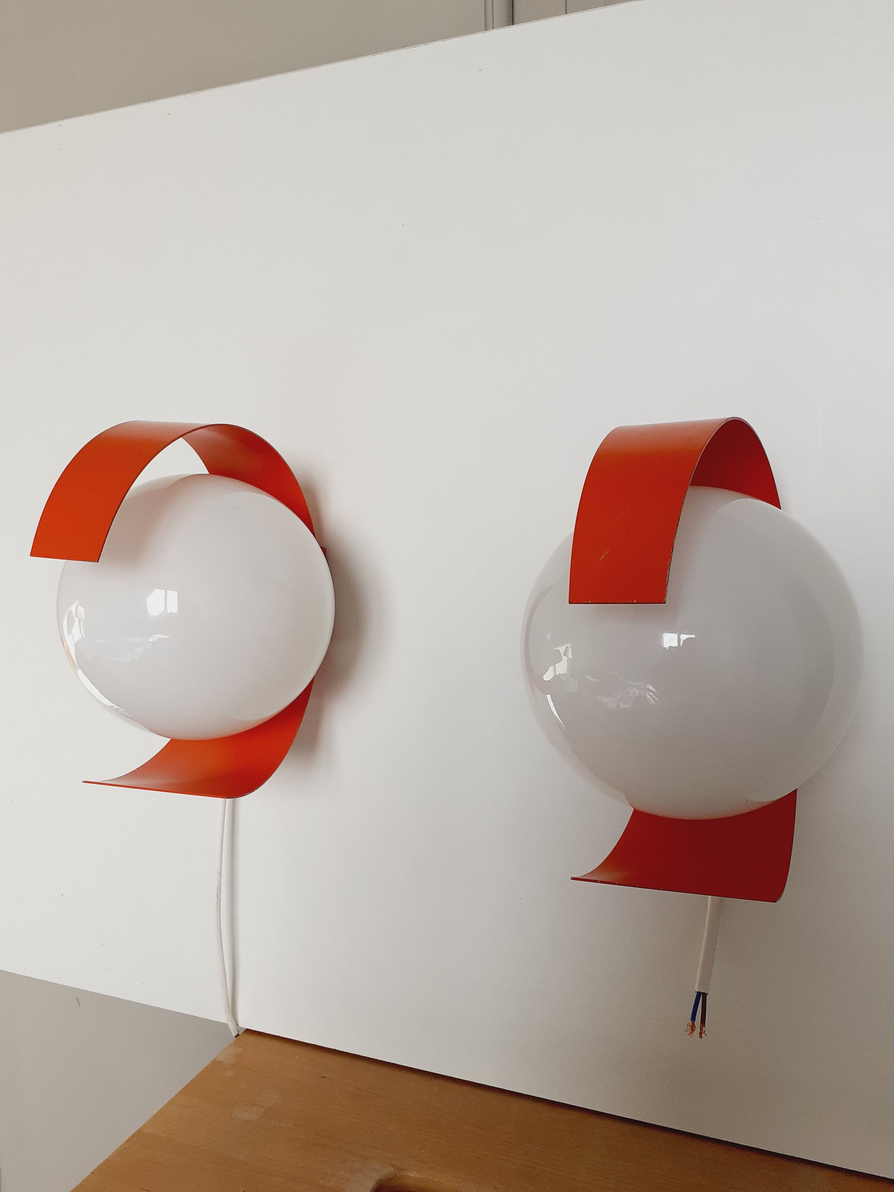 Pair of orange space age wall lamps