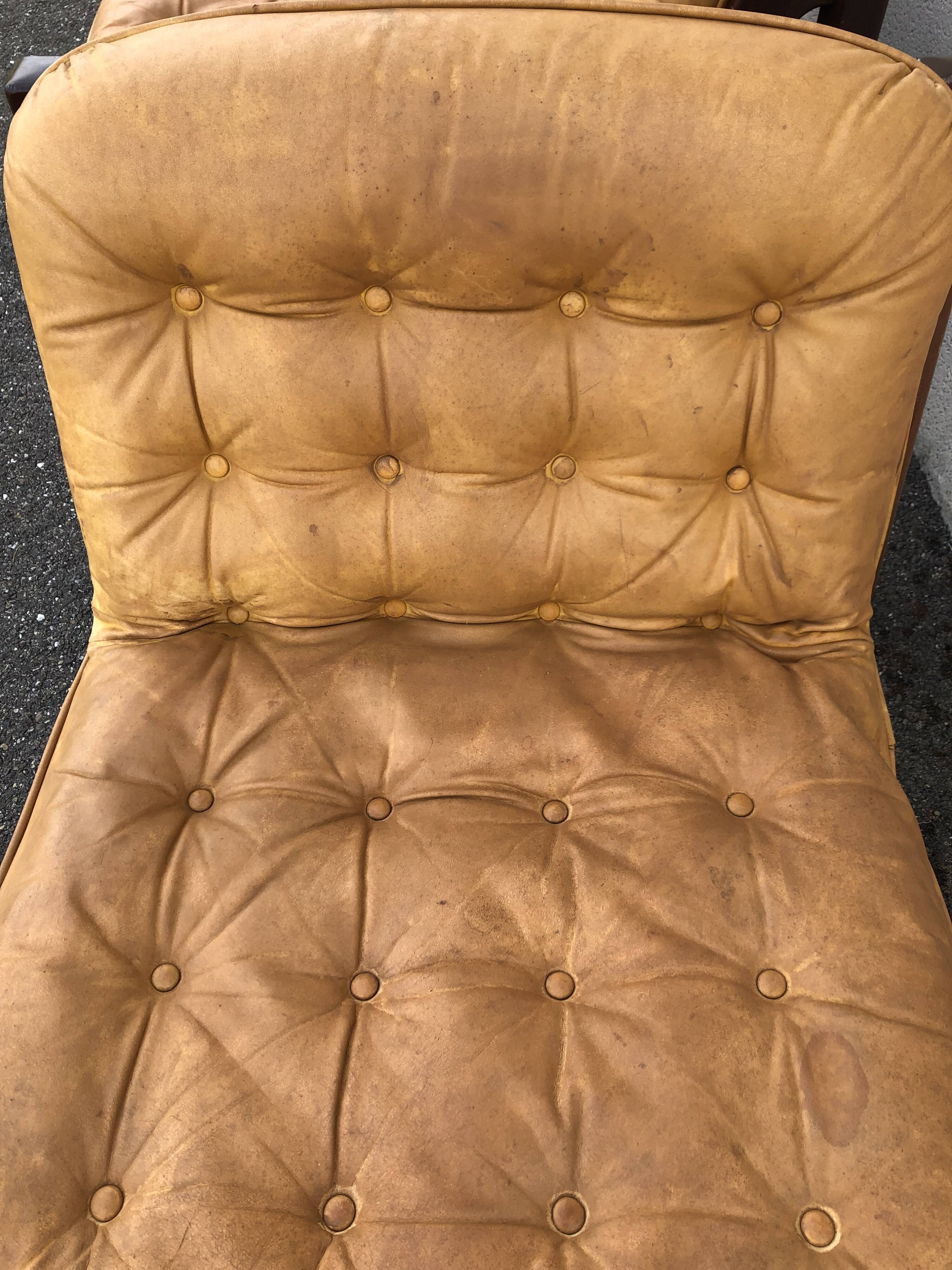 Leather and wood armchairs 70s