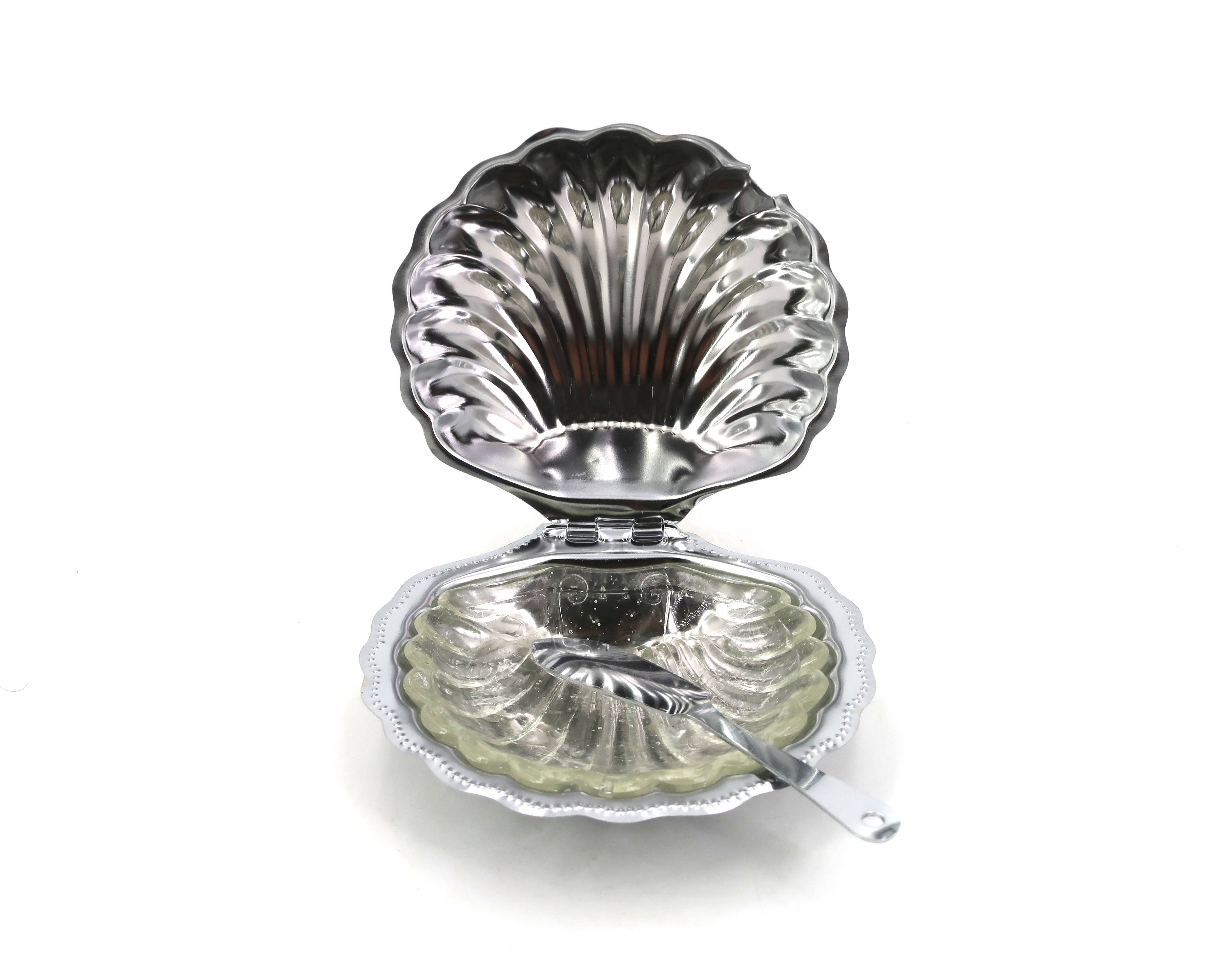 Silver-plated metal and glass shell-shaped butter dish with its knife.