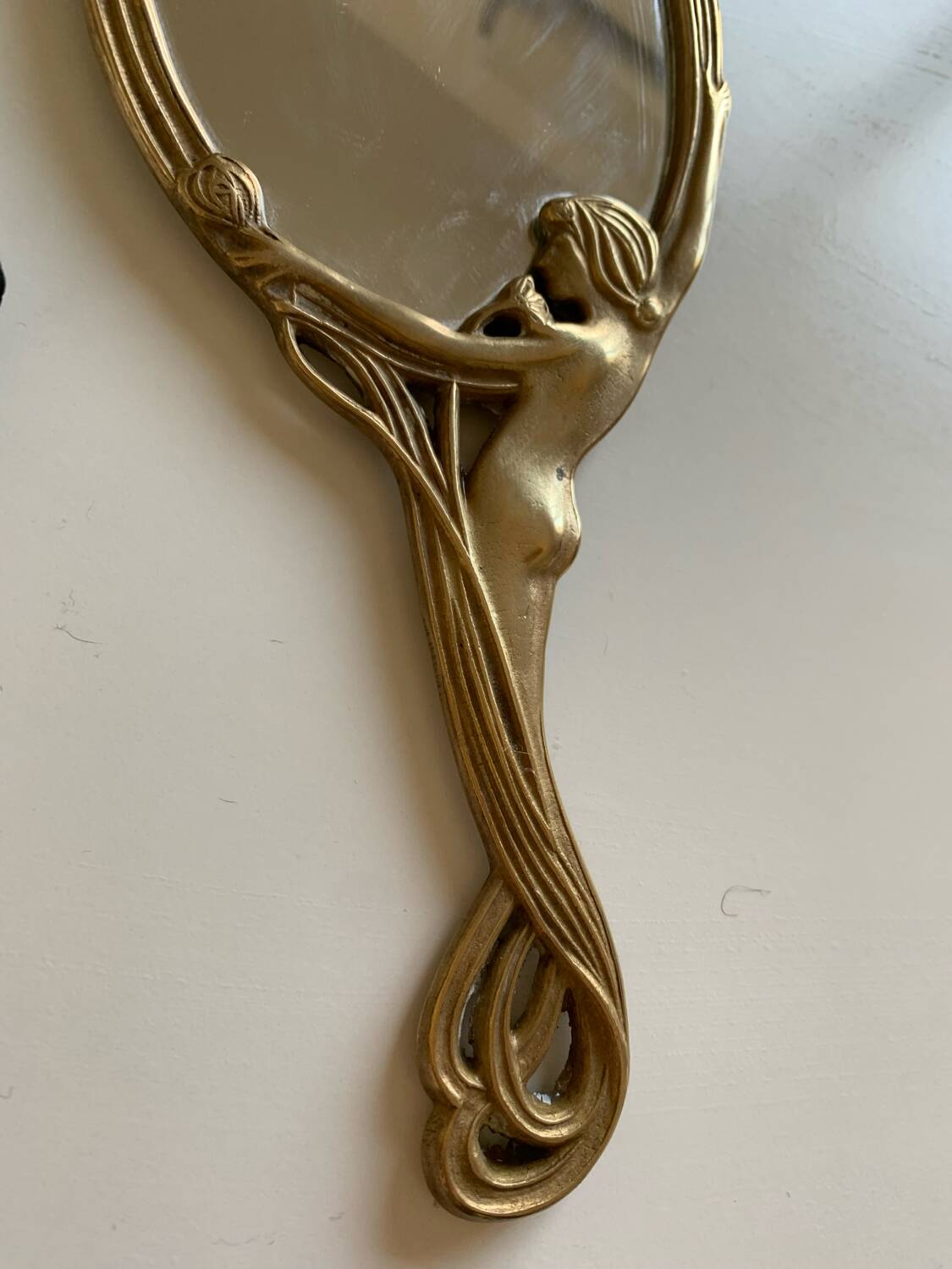 Art Nouveau brass mirror for women