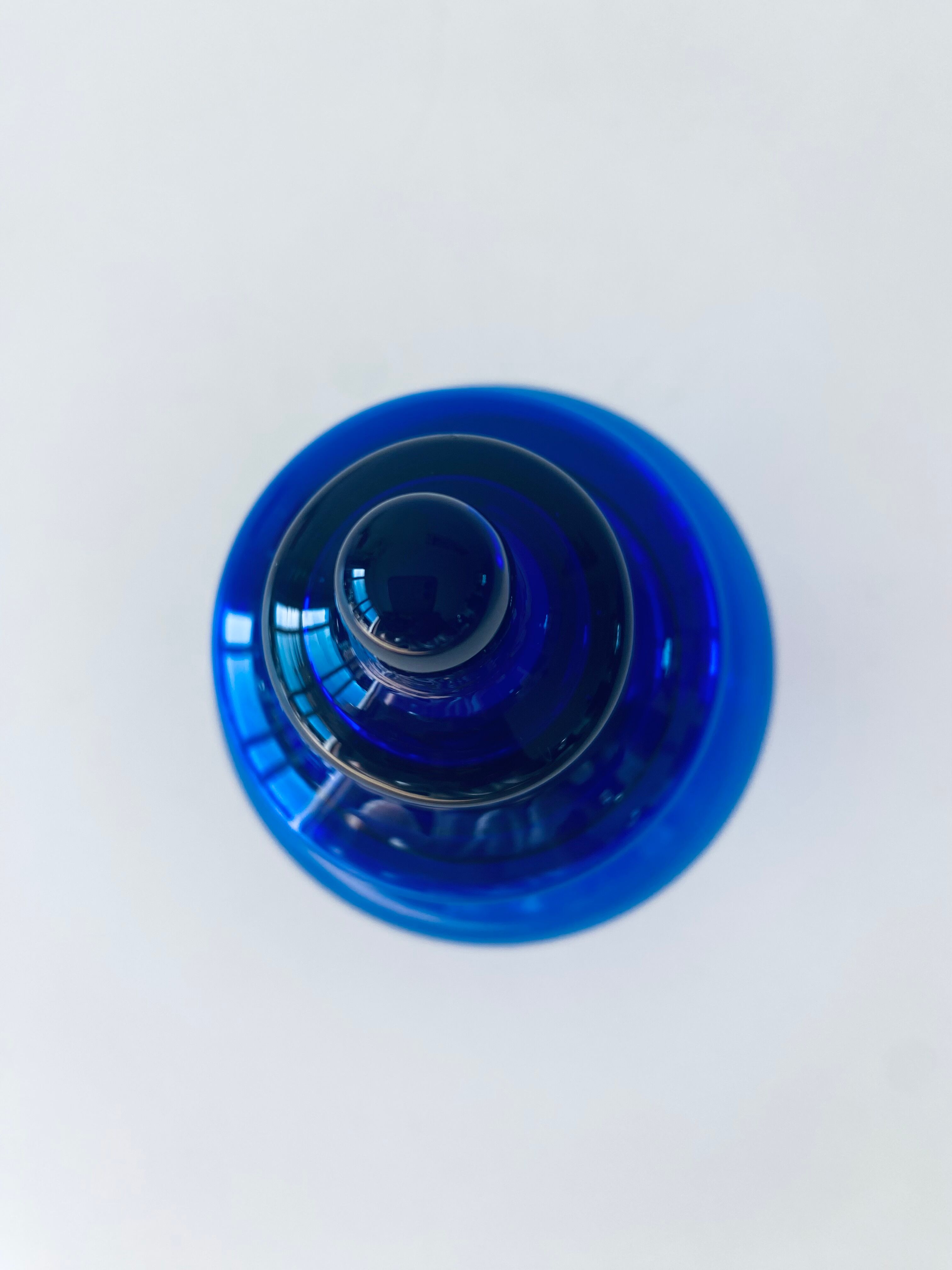 Blue glass apothecary shaped bottle