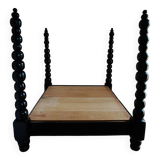 Black, solid wood four-poster bed, made by a craftsman in Mexico