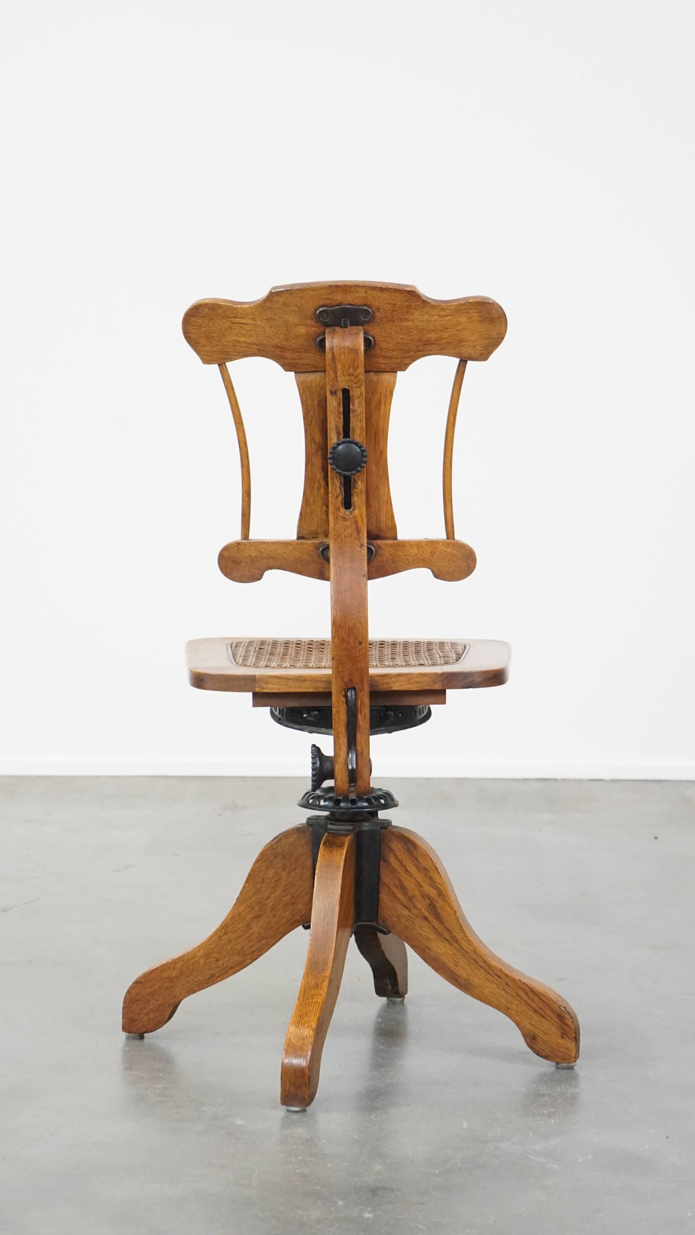 Antique late 19th century English office chair with reclining backrest and height adjustable