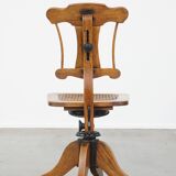 Antique late 19th century English office chair with reclining backrest and height adjustable