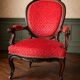 Napoleon III medallion armchair in carved wood and red velvet.