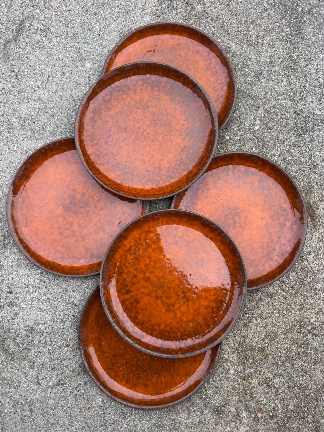 Orange glazed ceramic plates from the 1970s