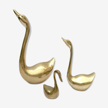 3 golden decorative swans
