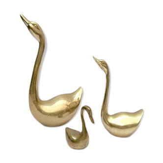 3 golden decorative swans
