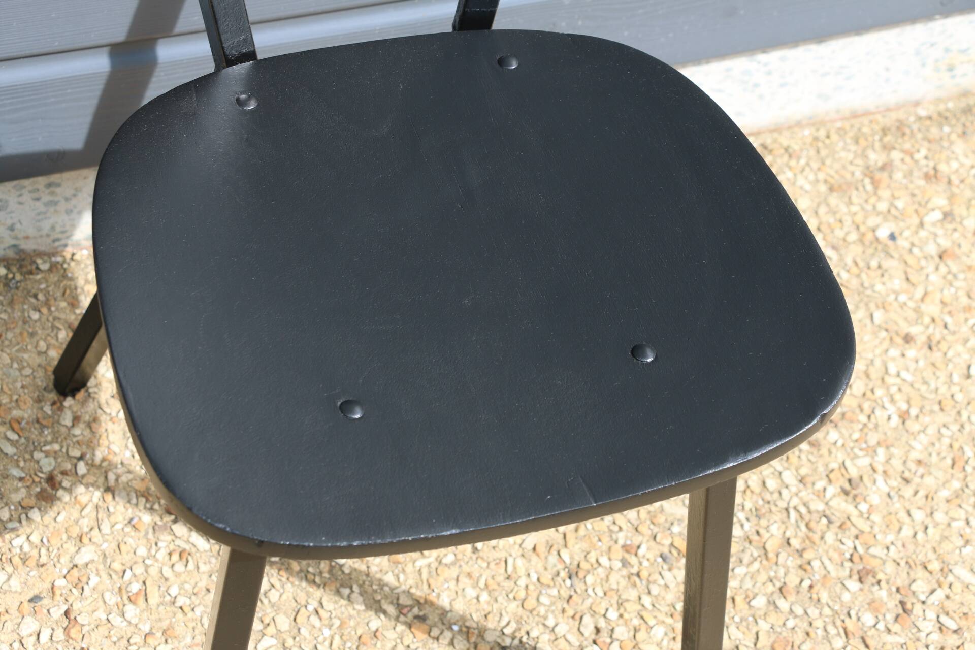 4 black metal and wood chairs