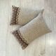 Pair of retro knitted wool cushions