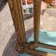 Large closed mirror, 19th century, wood and gilded stucco.