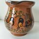 Glazed earthenware pitcher signed HR with a design of stylised birds.