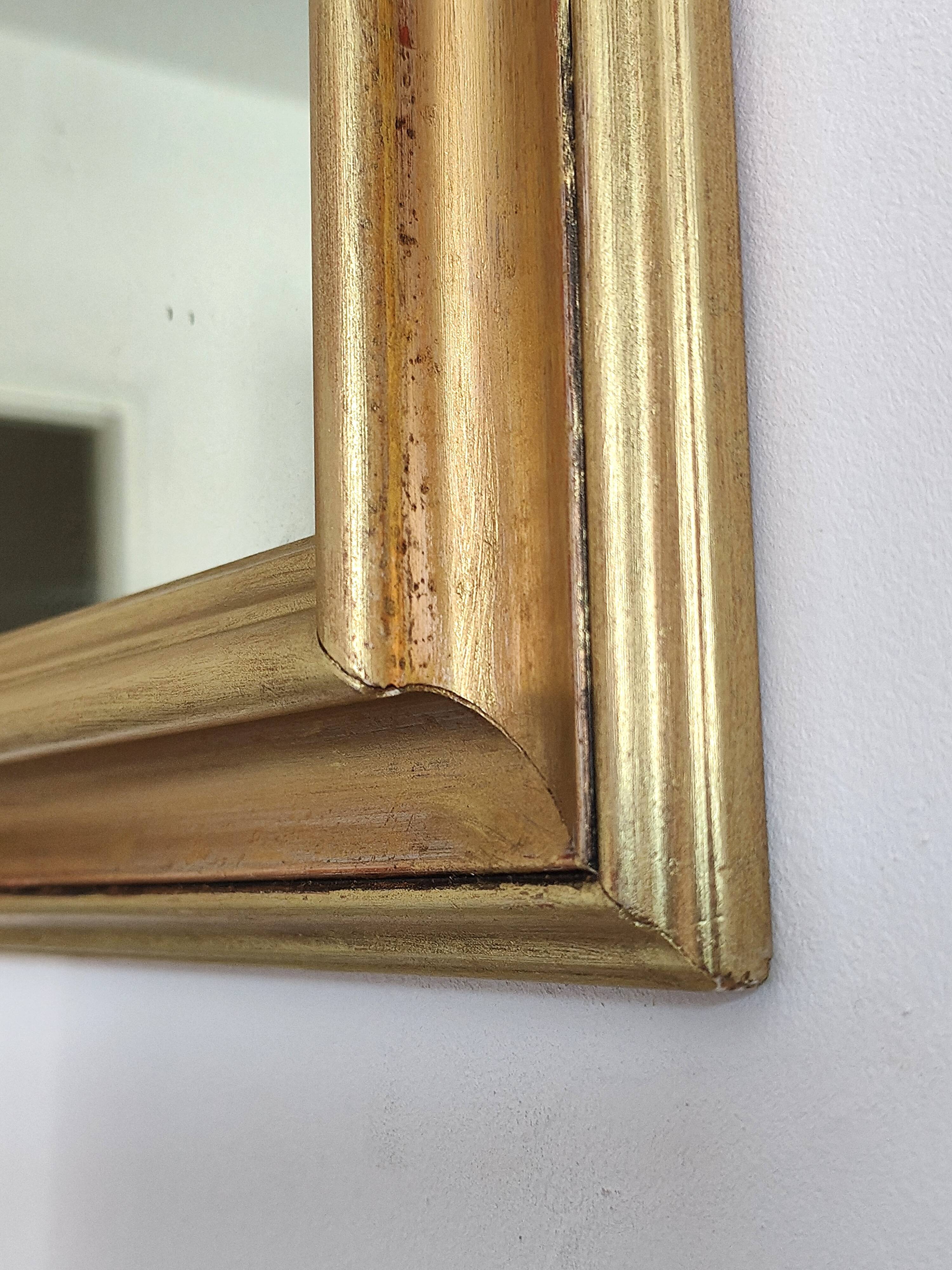 Miroir ancien en bois doré et cuivré