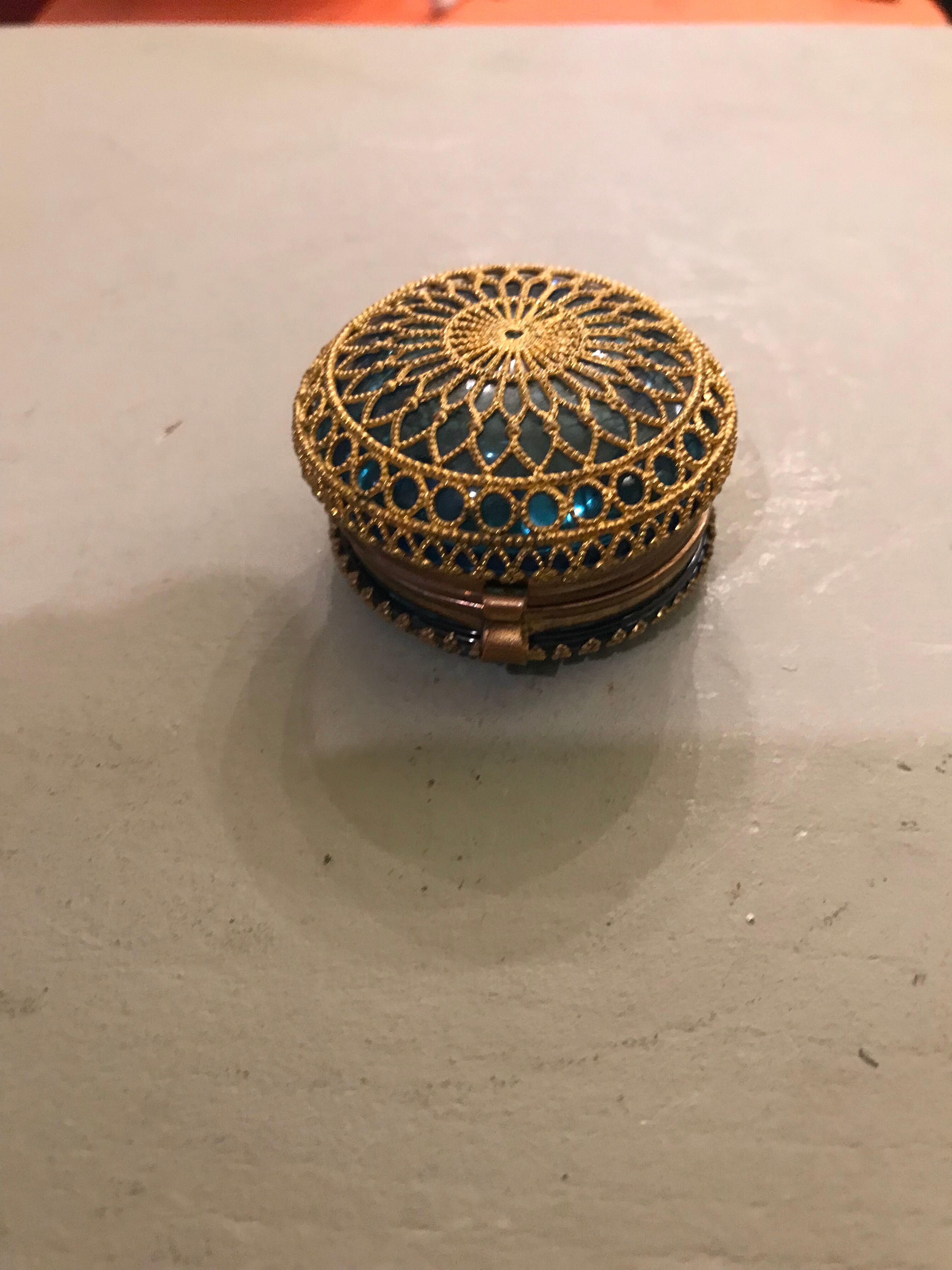 Old pill box made of golden thread