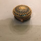 Old pill box made of golden thread