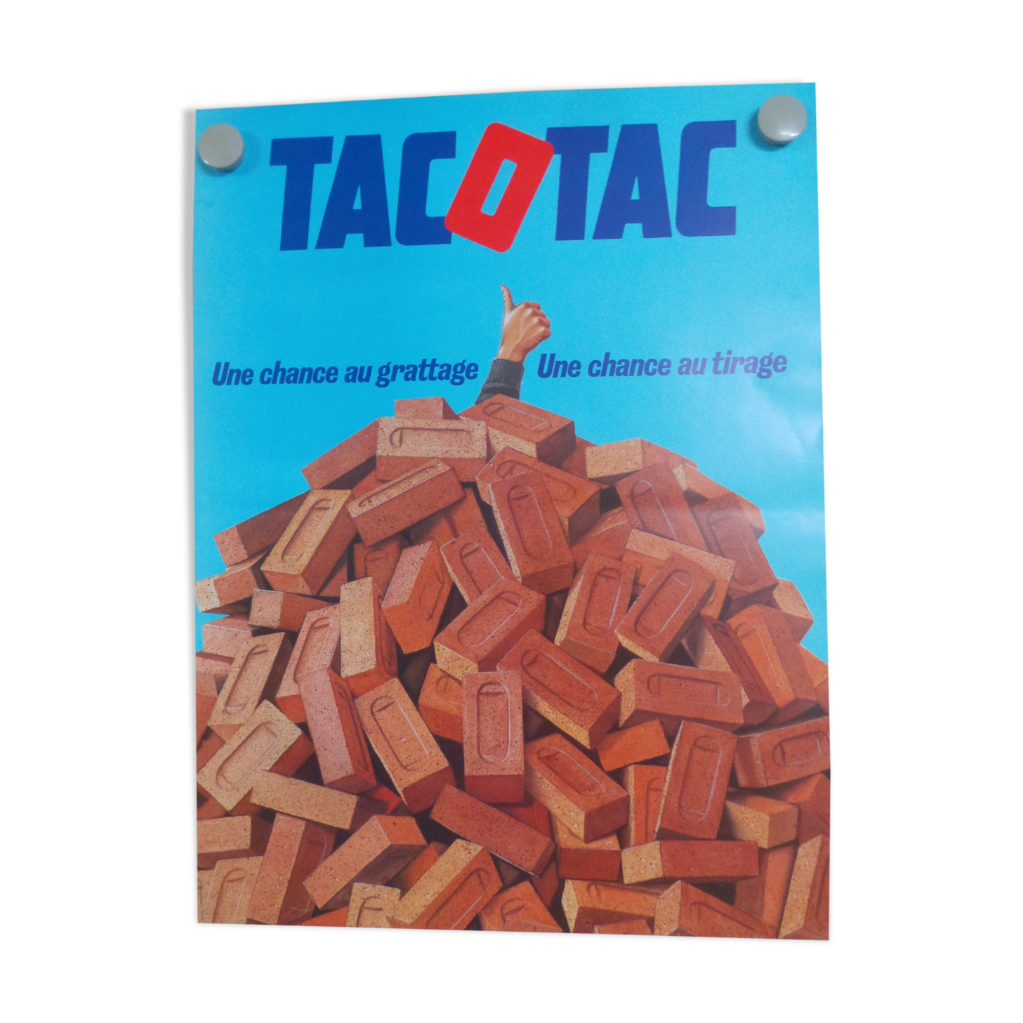 Original National Lottery poster tac o tac a chance at scraping and drawing bricks
