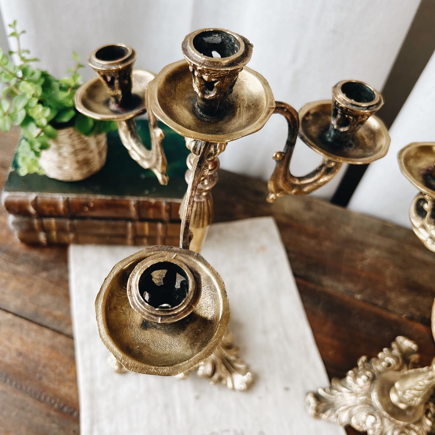 Duo of antique bronze chandeliers