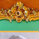 Old wooden frame and bronze ornament