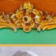 Old wooden frame and bronze ornament