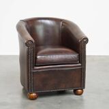 luxury dark leather club chair with English-style ball feet