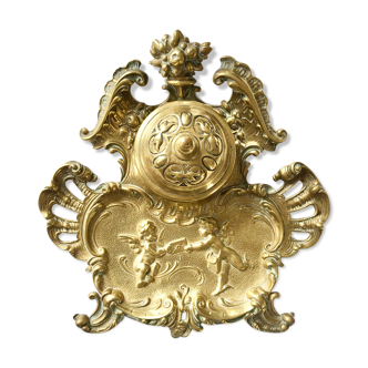 Needed to write ancient brass decorated with putti and stylized shells