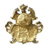Needed to write ancient brass decorated with putti and stylized shells