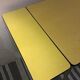 Table formica yellow and 2 red chairs