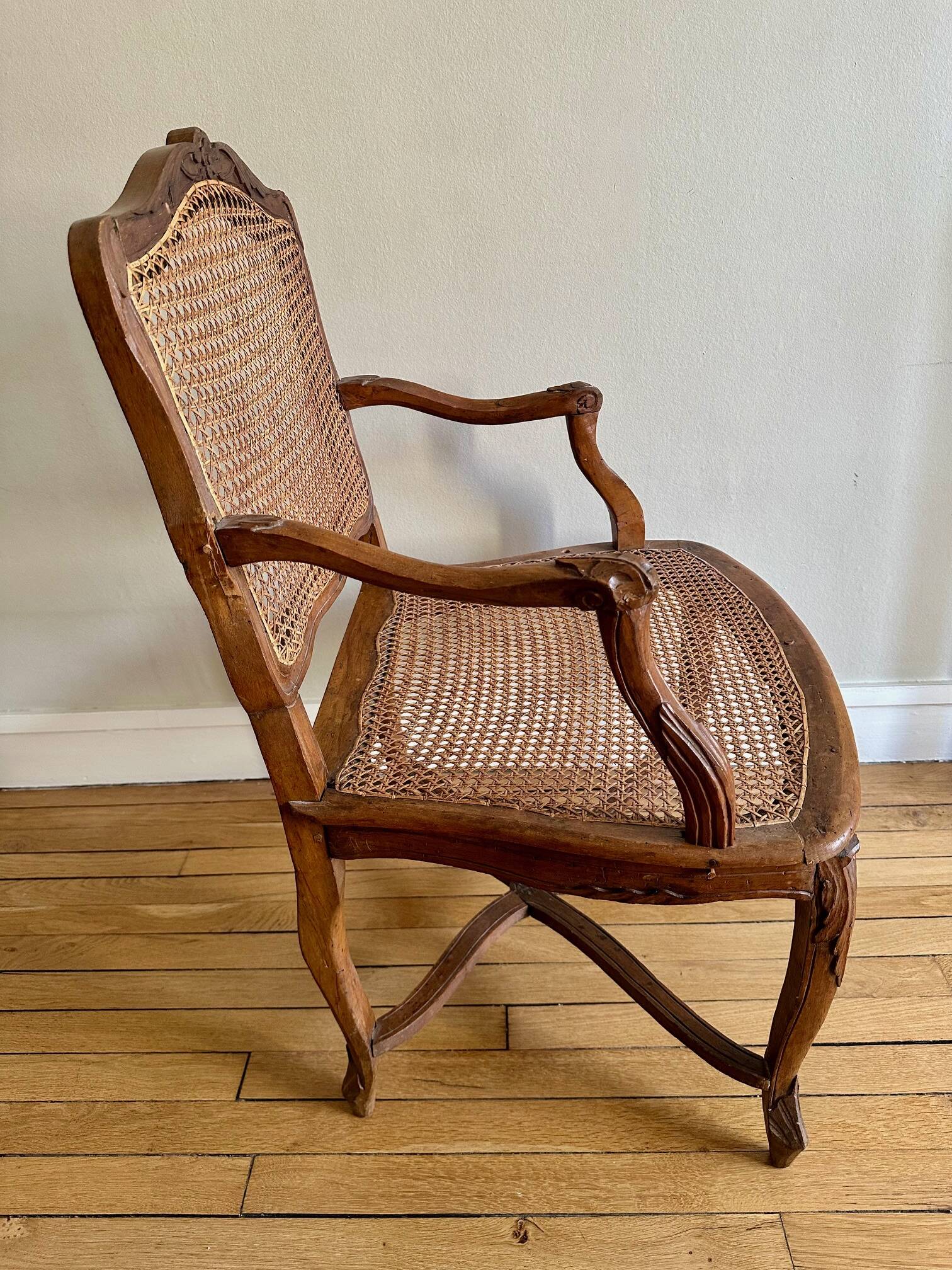 A pair of Regency armchairs with a stretcher.