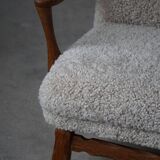 Viggo Boesen, high-back chair in oak and shearling lambskin, modern Danish design, 1950s.