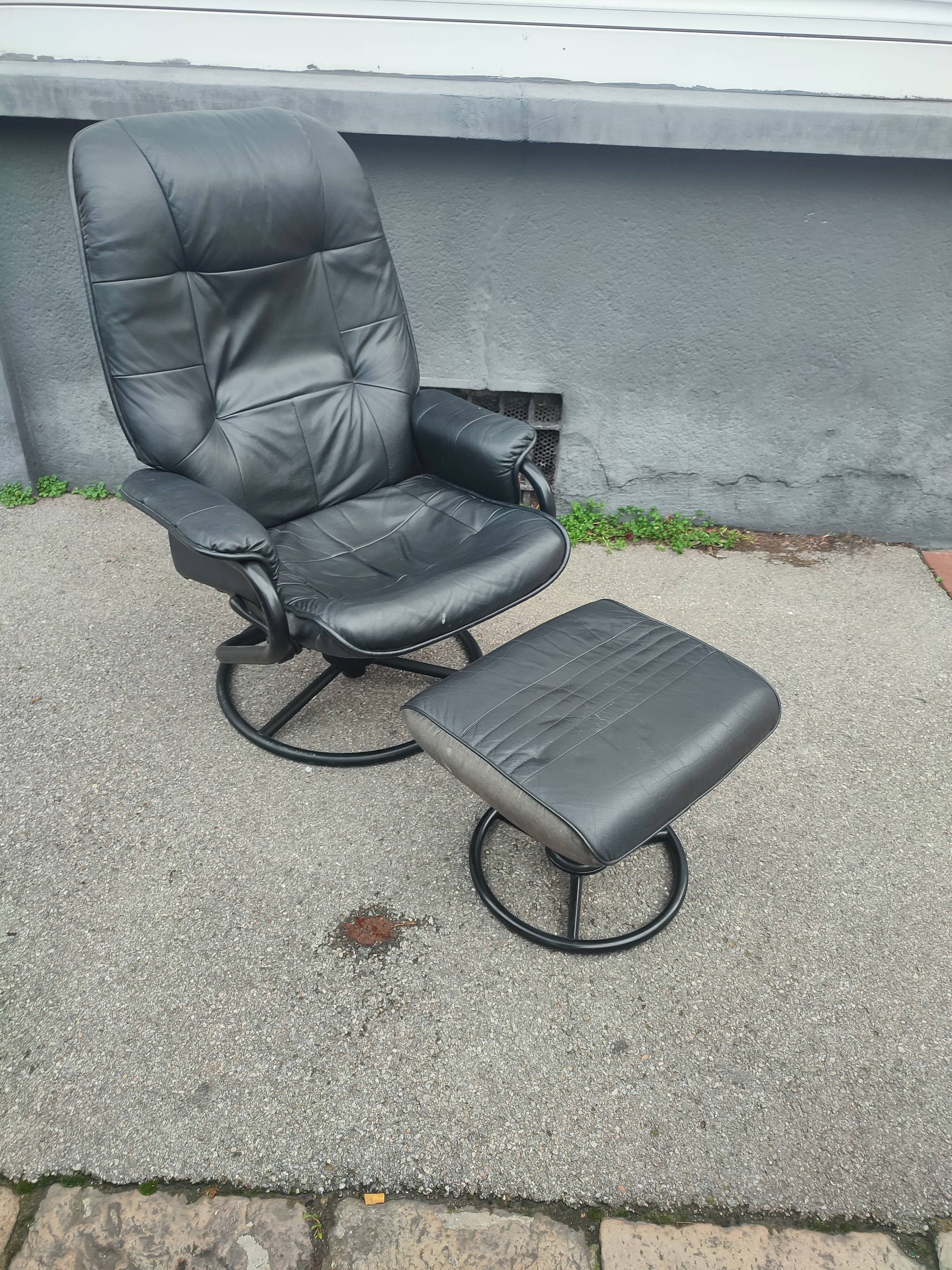 Scandinavian design leather armchair and footrest
